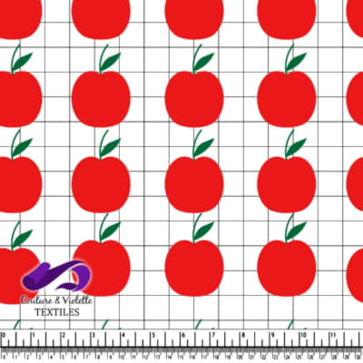 Pommes rouges sur un fond blanc à carreaux