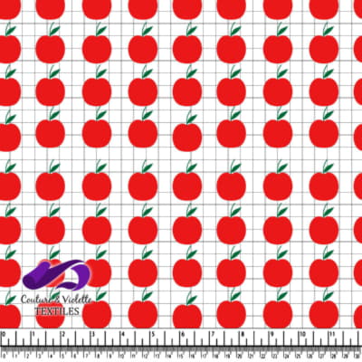 Pommes rouges sur un fond blanc à carreaux