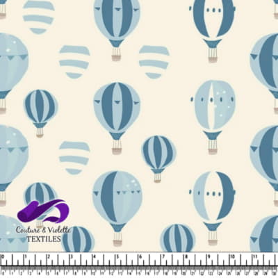 Various blue hot air balloons on beige background